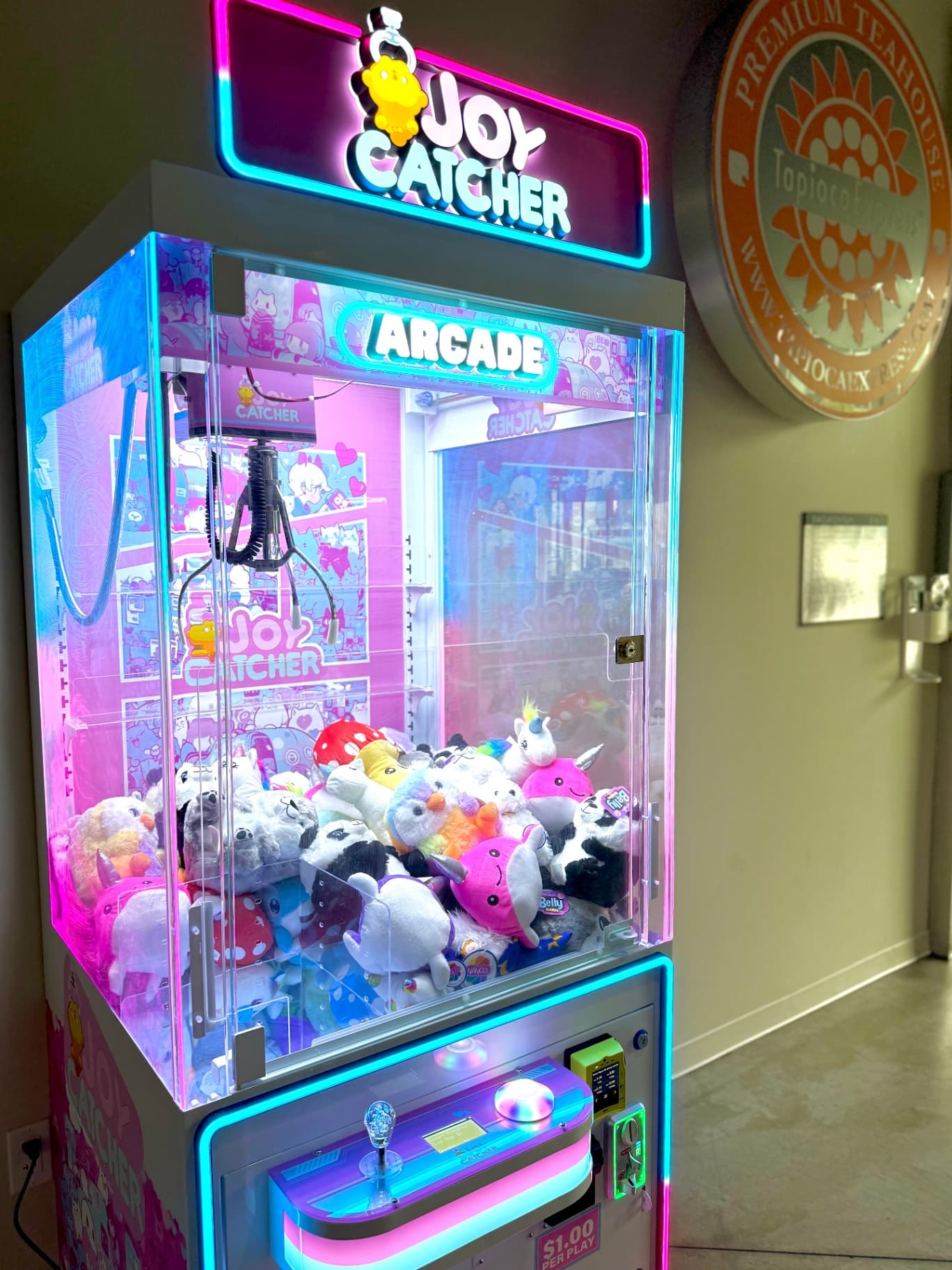 A California Claw machine stocked with plush prizes, ready for San Rafael